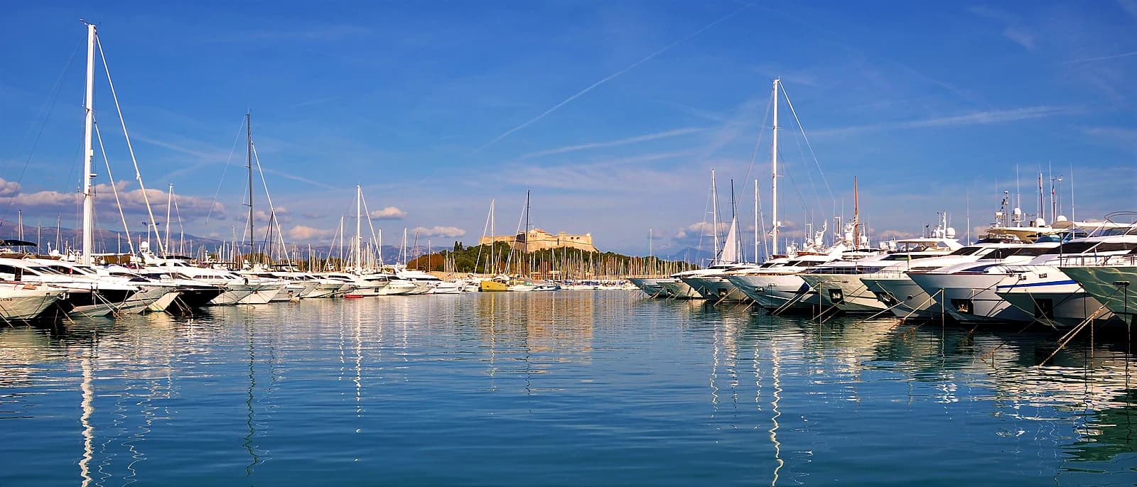 Yachts moored at Port Vauban, Antibes, with the Fort Carré on the horizon